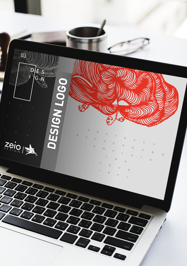 Ordinateur portable affichant un design graphique abstrait.